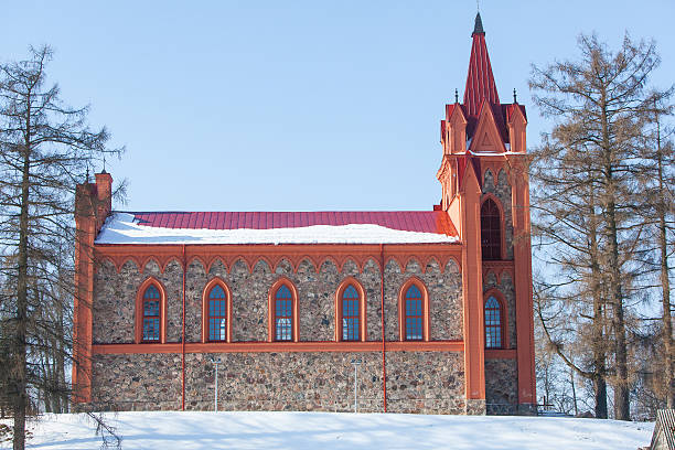 istock Red church in winter time 466309891