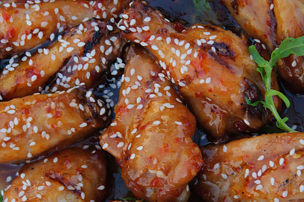 Chiken wings with hot sauce Chiken wings with hot sauce with sesame sticky sesame chicken sauces stock pictures, royalty-free photos & images