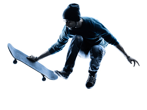 one caucasian man skateboarder skateboarding  in silhouette isolated on white background