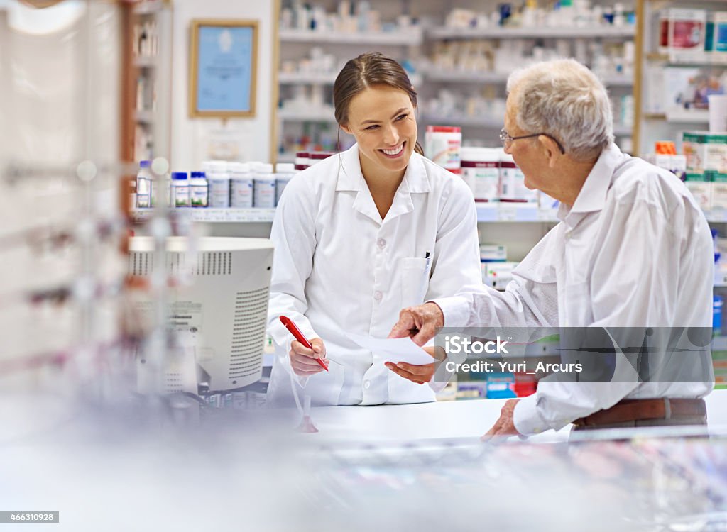 Providing clients with all the information they need Shot of a young pharmacist helping an elderly customer at the prescription counter. The commercial product(s) or designs displayed in this image represent simulations of a real product, and are changed or altered enough so that they are free of any copyright infringements. Our team of retouching and design specialists custom designed these elements for each photo shoot http://195.154.178.81/DATA/i_collage/pi/shoots/785200.jpg Pharmacy Stock Photo
