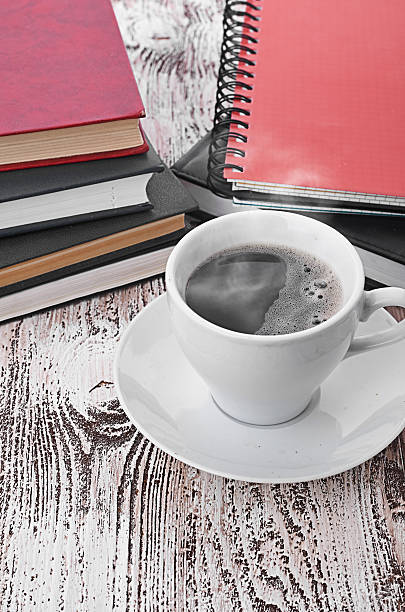 istock Cup of coffee on a wooden table 466311161