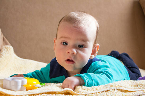 istock Cute baby boy lying on tummy 466311630