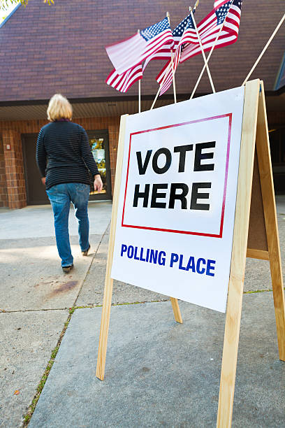 istock Voter Entering US Polling Place for Voting Vertical 466314290