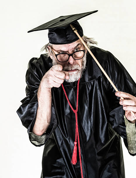 Graduate boy jumping with his cap in the air