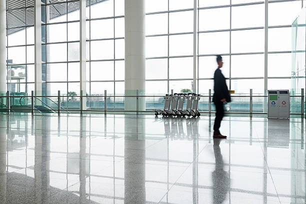 istock people silhouette in hall of office building 466314764
