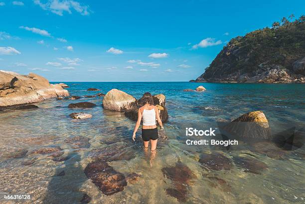 Woman Walks Into Exotic Ocean In Thailand Stock Photo - Download Image Now - 20-29 Years, 2015, Active Lifestyle