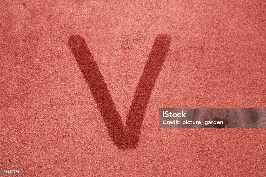 Letter V handwriting V, fabric formed against the fur on brown red suede leather 2015 Stock Photo