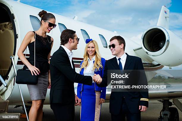 Cabin Crew And Passengers Stock Photo - Download Image Now - Corporate Jet, Luxury, Pilot