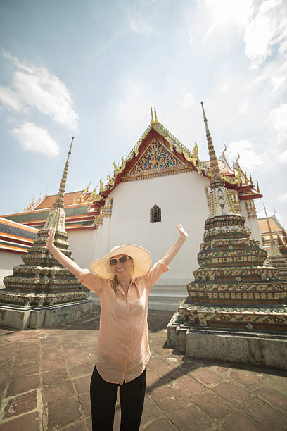 istock Cheerful tourist visiting Thai temples 466319270