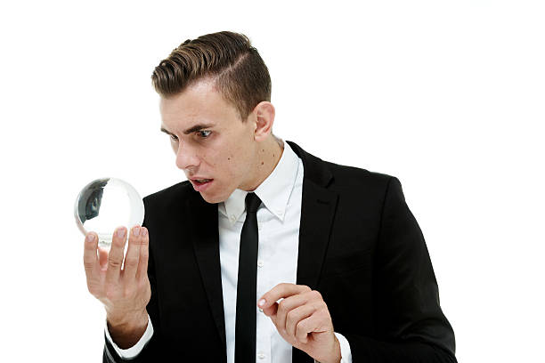 istock Businessman watching future in crystal ball 466319390