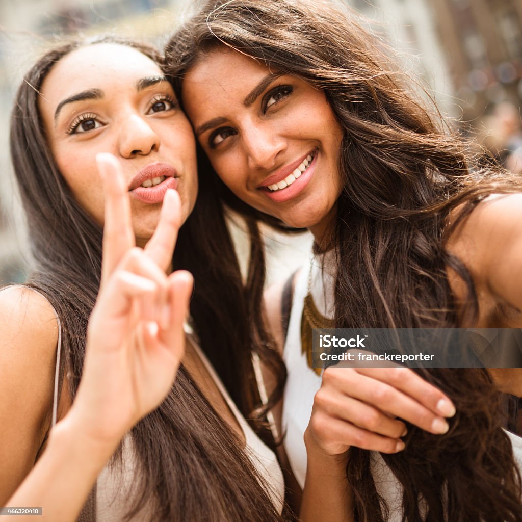 Couple of friends doing a selfie on the city Image-based Social Media Stock Photo