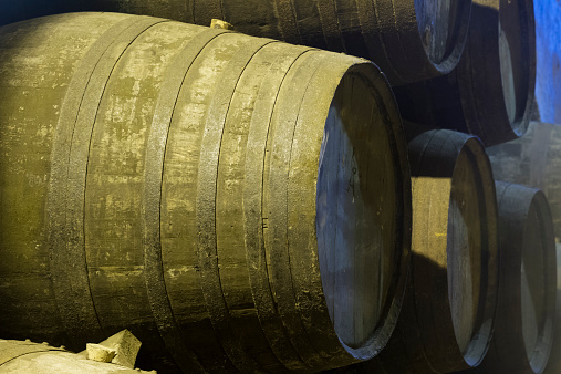 traditional  aged  wooden   wine barrels close up 