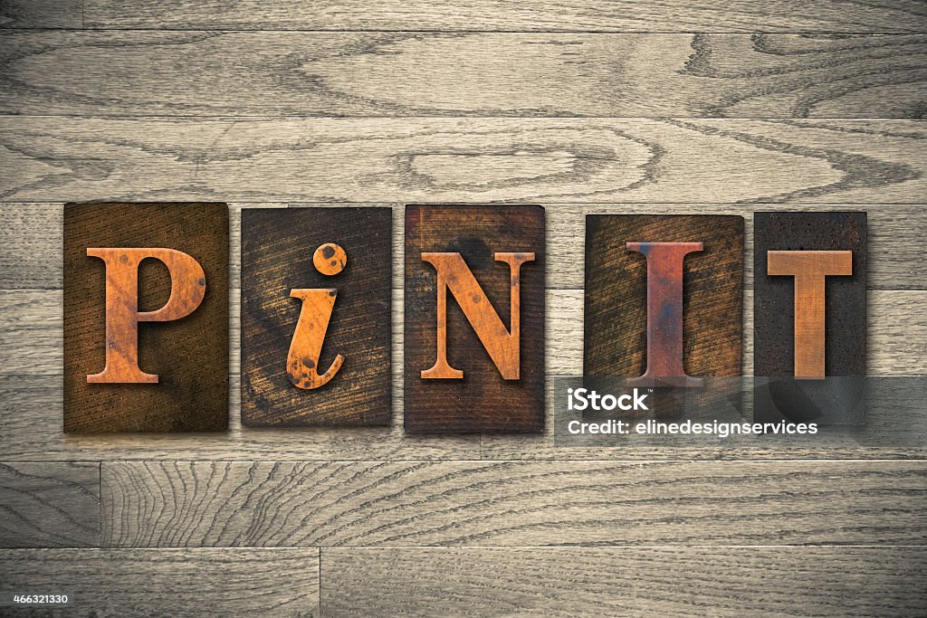 Pin It Concept Wooden Letterpress Type The words "PIN IT" written in wooden letterpress type. 2015 Stock Photo