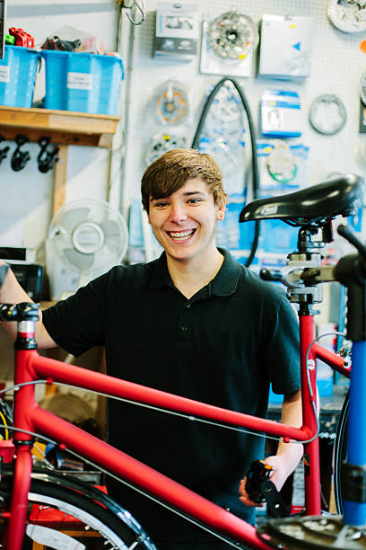 istock Servicing bicycles in a bicycle shop. Looking at the camera 466321798