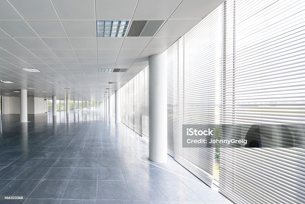 Windows in empty office floor of modern business building interior Window Blinds Stock Photo