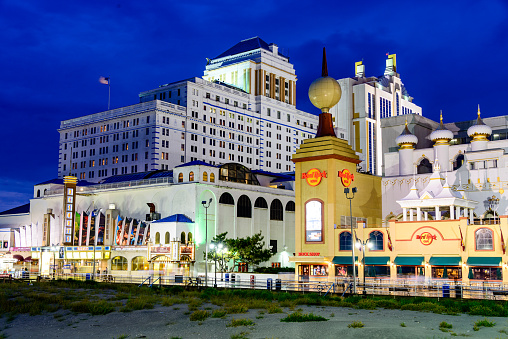 Atlantic City, New Jersey, USA - September 8, 2012: Casinos line the Atlantic City boardwalk at dusk. The city is considered the gambling capital of the east coast.