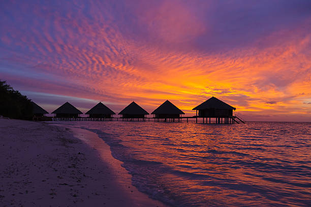 Sunset in the Maldives with a view of the beach stock photo