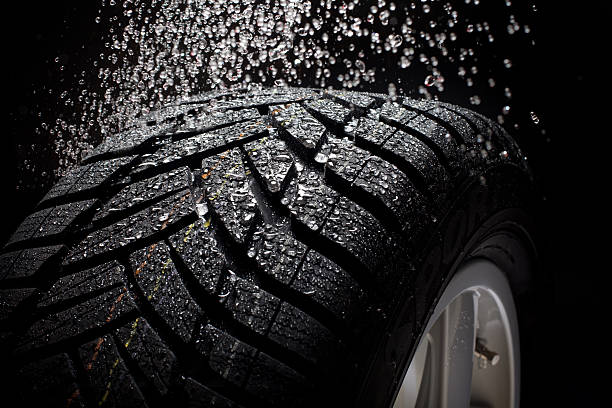 istock sport car tire with water drops 466325980