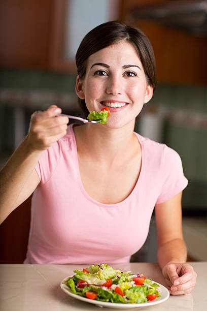 istock Woman having vegetable salad 466327142