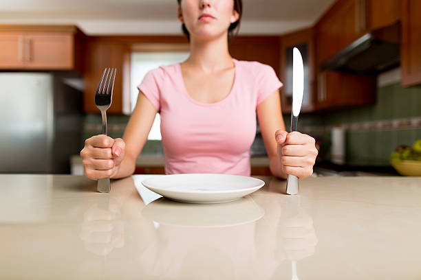 istock Woman sitting in a kitchen 466327296