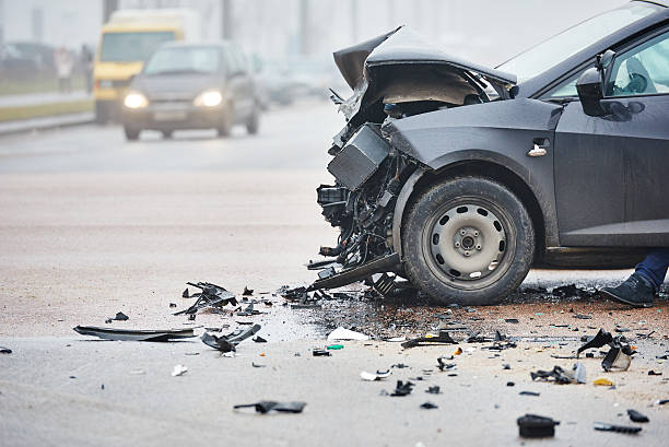Car crash in urban street with black car car crash accident on street, damaged automobiles after collision in city misfortune stock pictures, royalty-free photos & images