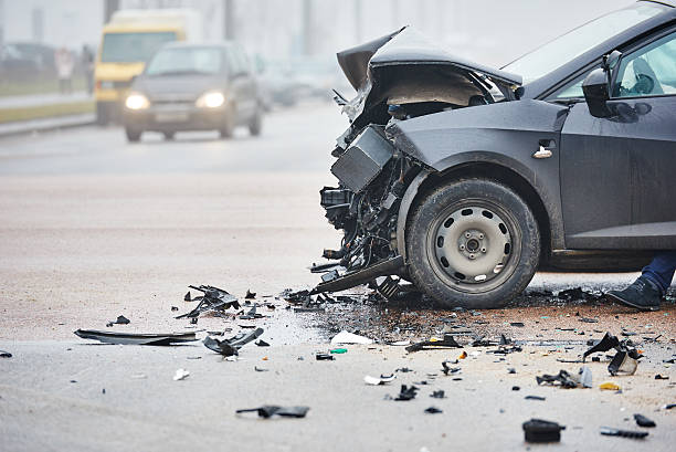 Car crash in urban street with black car car crash accident on street, damaged automobiles after collision in city beat up car stock pictures, royalty-free photos & images