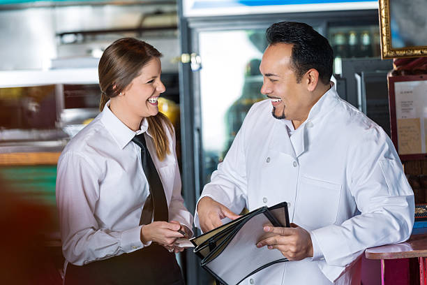 istock Waitress and chef in restaurant laughing together 466328060