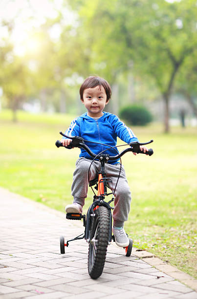 istock Children ride a bike 466330532