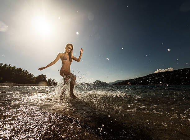 istock Playful woman at sea. 466331138