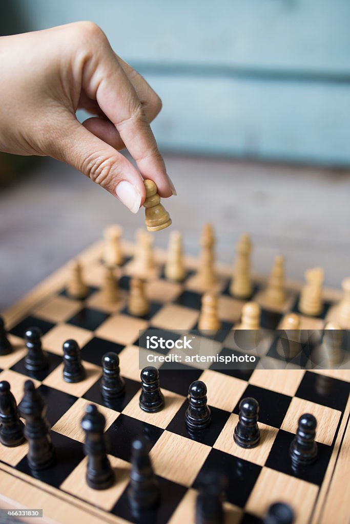 Chess Competition Playing wooden chess pawn 2015 Stock Photo