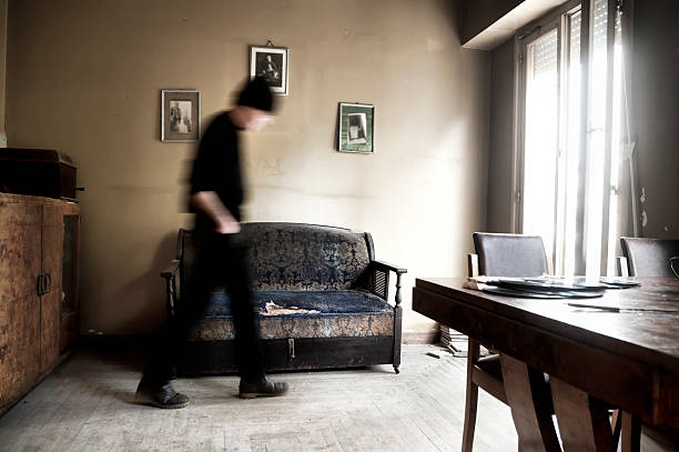 Man walking in a room stock photo