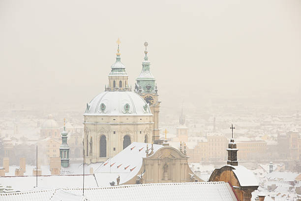 Prague winter Snowfall in Prague, Czech Republic st nicholas church prague stock pictures, royalty-free photos & images