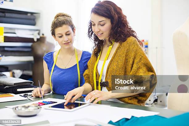 Young Women Checking Some Fashion Ideas On Digital Tablet Stock Photo - Download Image Now