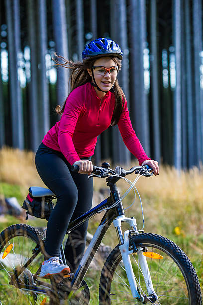 istock Girl riding bike on forest trails 466336482