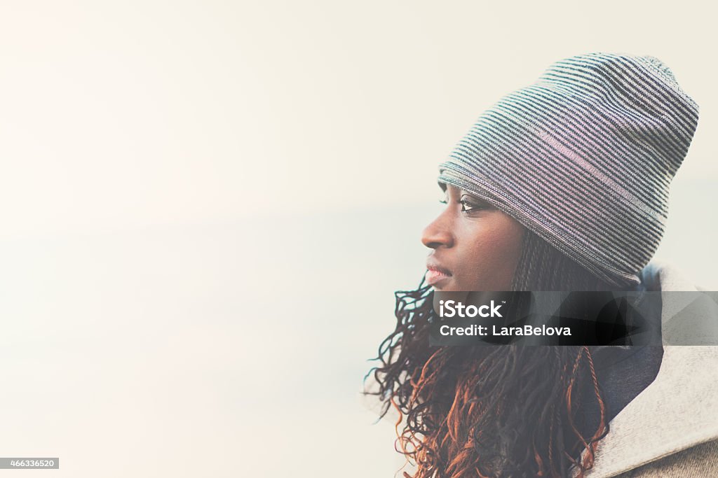 Portrait of young African woman in profile Portrait of young African woman looking away. African-American Ethnicity Stock Photo