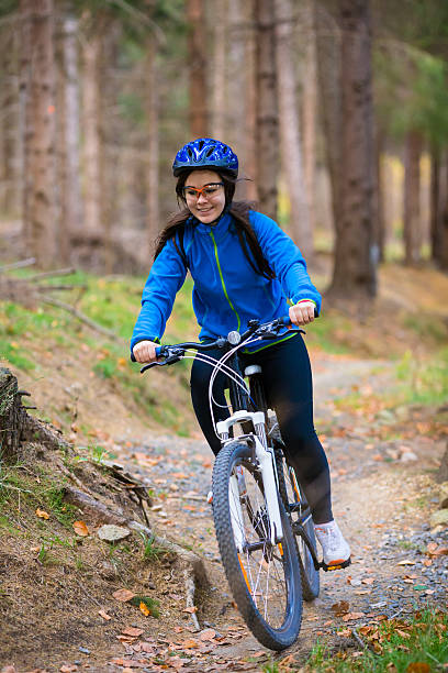 istock Girl riding bike on forest trails 466336740