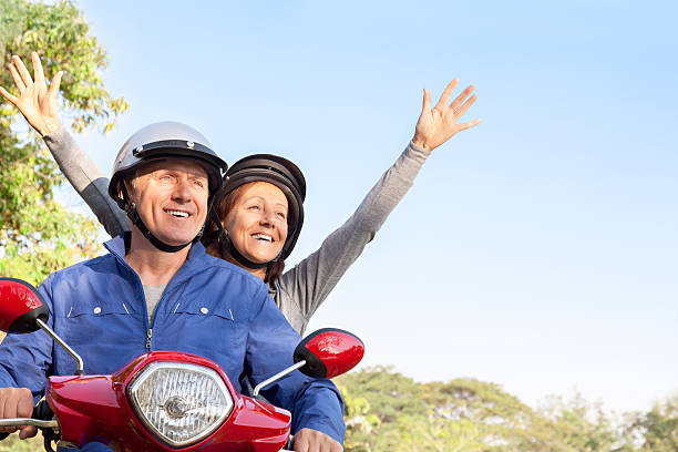 istock Happy Mature Couple Riding a Motor Scooter 466338946