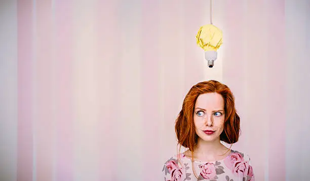 Photo of Thinking Woman With Lightbulb Above Head