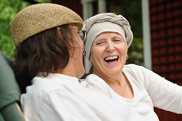 istock senior woman laughs at joke 466339176