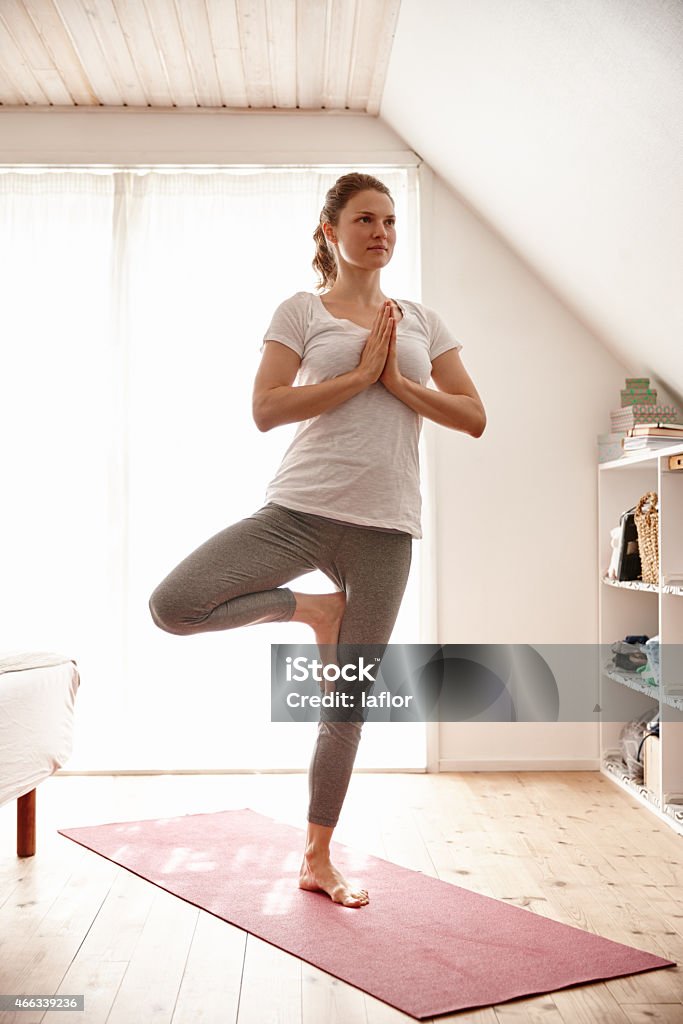 This is her time to unwind Shot of an attractive young woman doing yoga at homehttp://195.154.178.81/DATA/istock_collage/a4/shoots/785284.jpg Yoga Stock Photo