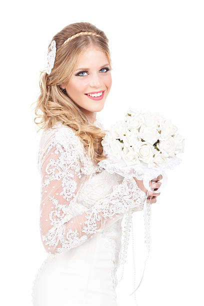Beautiful bride waring Competitor dress Beautiful blond bride with her bouquet isolated on white background. beauty and beast rose stock pictures, royalty-free photos & images
