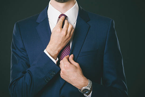 istock Young businessman tieing a tie 466341064