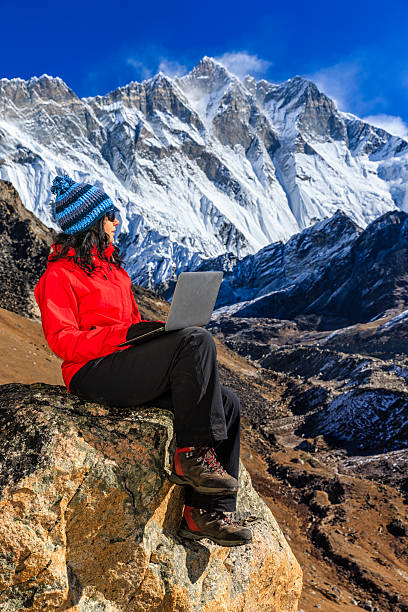 istock Young woman using laptop in Himalayas, Nepal 466341072