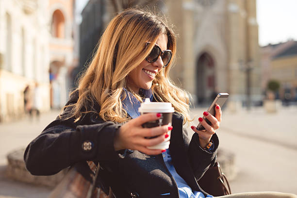 istock Cheerful woman using smart phone 466341362