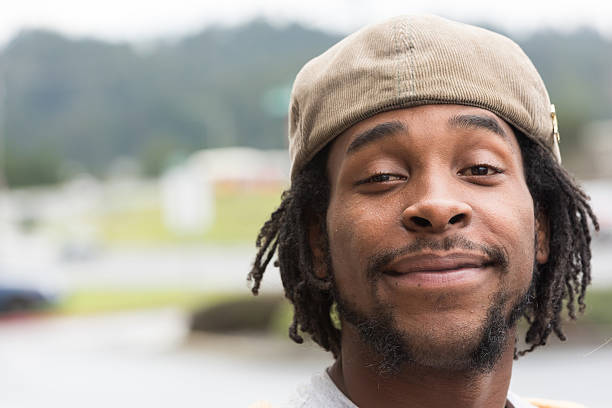 istock Smiling Afro-Caribbean man with dreadlocks and hat 466341650