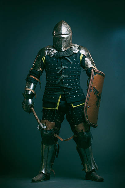 Medieval knight dressed for Medieval combat fight sport. Medieval Knight portrait. Medieval combat fight is an uprising sport where contestants fight with real weapons. knight person stock pictures, royalty-free photos & images