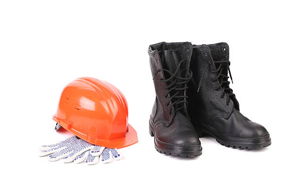 istock Kersey boots and hard hat on gloves. 466345433