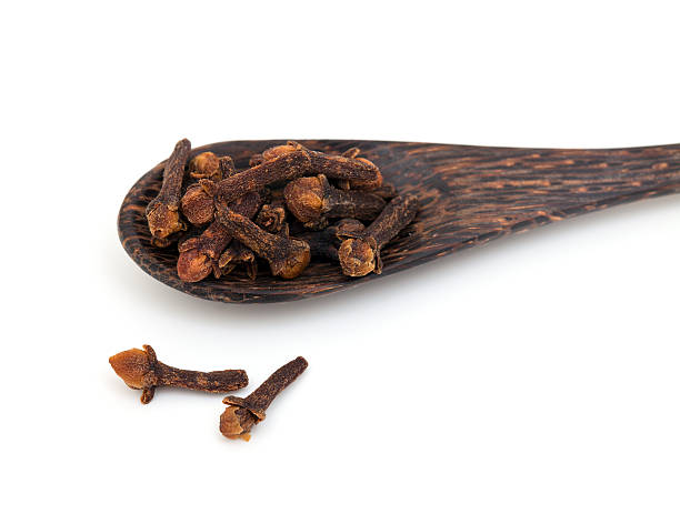 istock cloves on a wooden spoon 466346823
