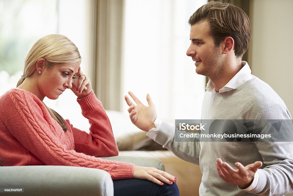 Young Couple Having Argument At Home Young White British Couple Having Argument At Home 20-29 Years Stock Photo