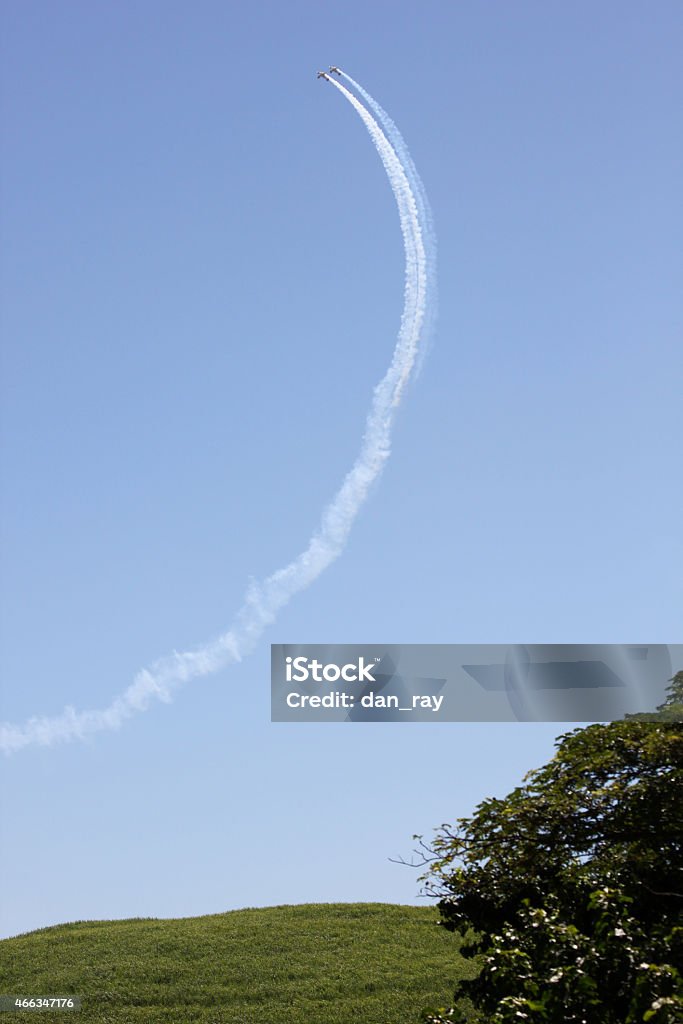 Planes performing aerobatic manoeuvre Two planes performing an aerobatic manoeuvre. 2015 Stock Photo